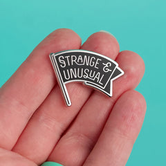 Strange & Unusual Enamel Pin | Dragon's Lair Comics and Fantasy Houston TX
