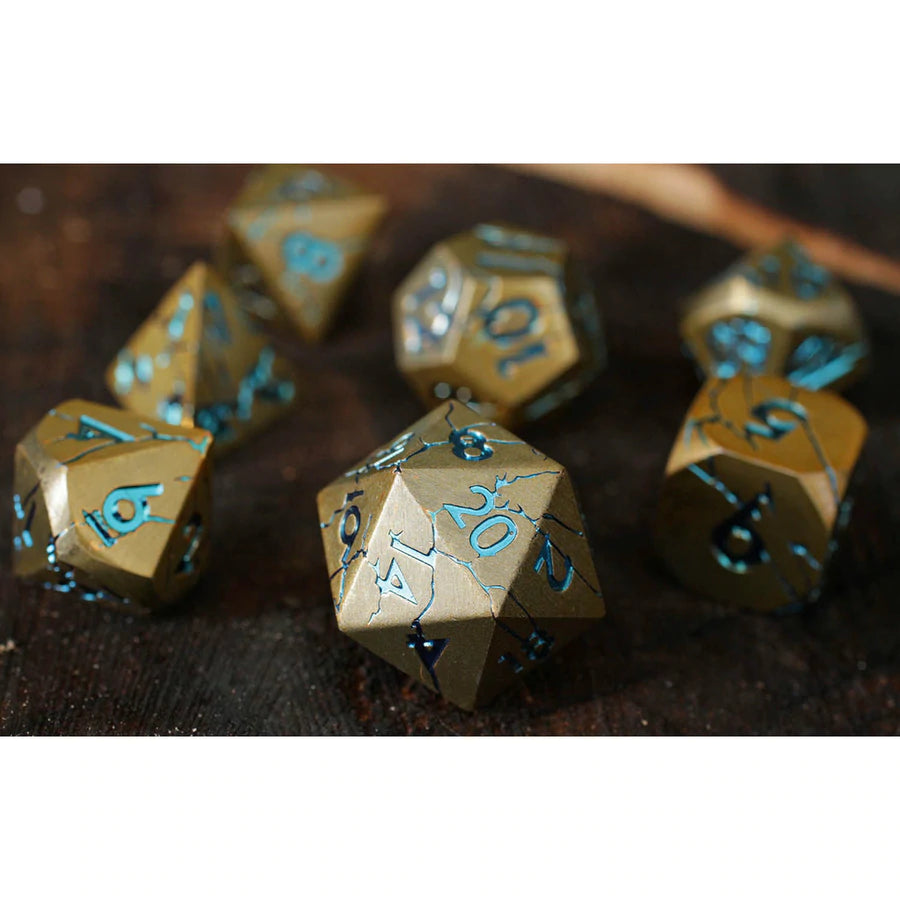 Forged Gaming Warworn Gold Poly 7 Metal Dice Set | Dragon's Lair Comics and Fantasy Houston TX